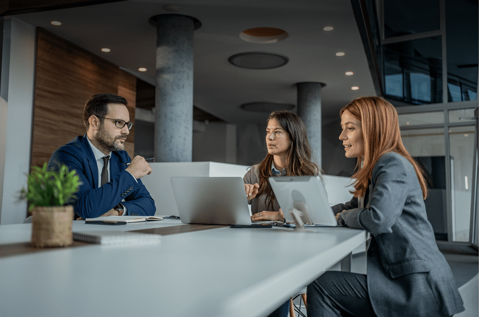Professional colleagues collaborating in modern workspace